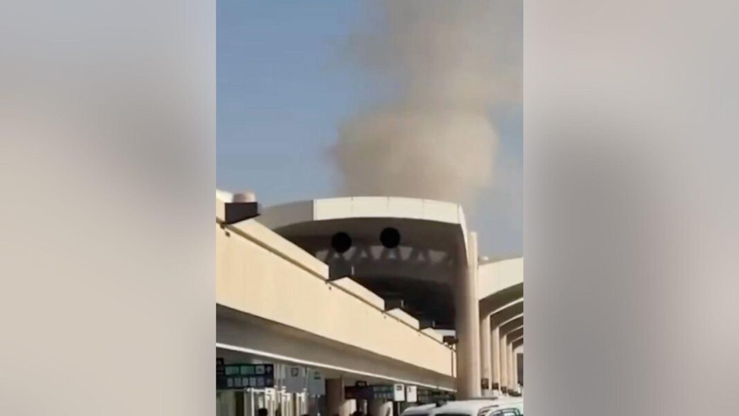 Saudi minister vows ‘serious response’ to Houthi attacks on airports Smoke rises above King Khalid airport in Riyadh.