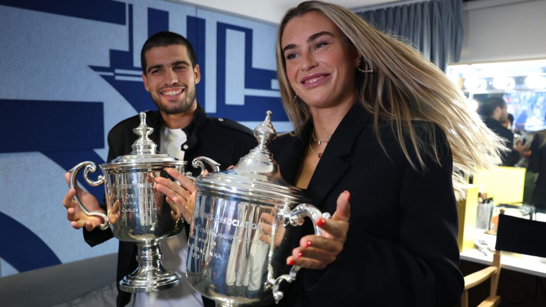 Carlos Alcaraz and Aryna Sabalenka pose with their US Open singles trophies