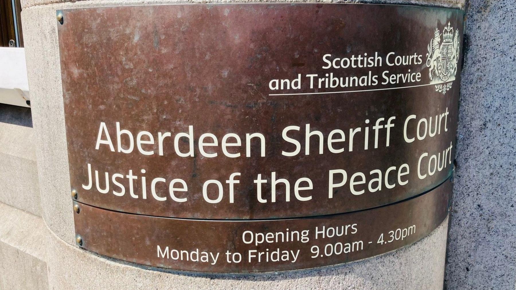 Sign which says Aberdeen Sheriff Court and Justice of the Peace Court.