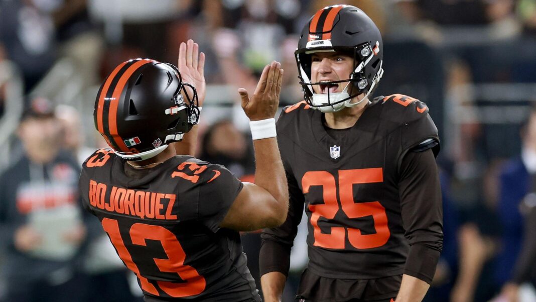 Andre Szmyt, wearing 25, of the Cleveland Browns celebrates with Corey Bojorquez, wearing 13, after kicking a 56-yard game winning field goal against the Pittsburgh Steelers