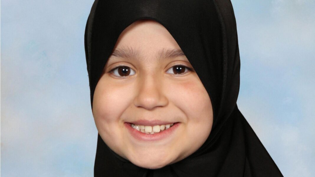 Sara Sharif’s grandfather granted guardianship of her siblings in Pakistan Sara Sharif smiling and looking directly at the camera. She is wearing a black hijab.