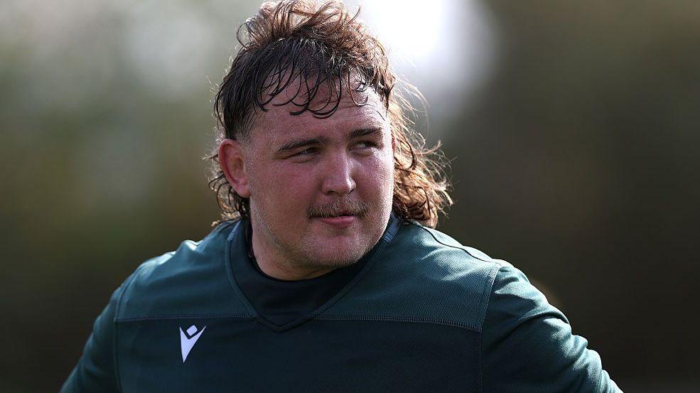JJ Van Der Mescht in a dark green training top.