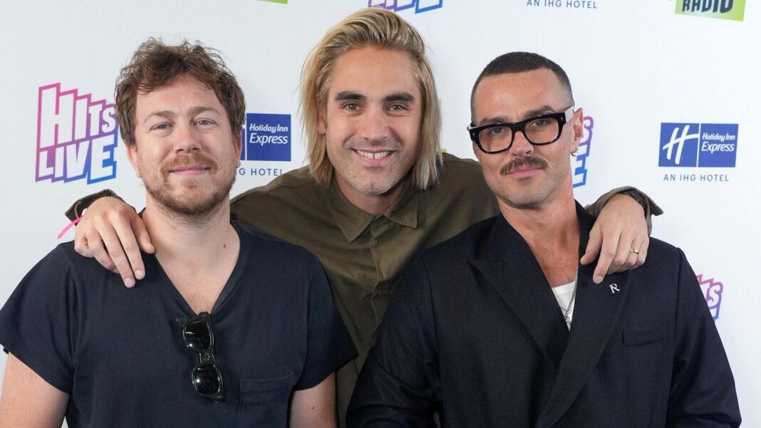 Busted’s James Bourne says ‘hero’ brother saved his life with kidney donation Bourne standing and posing with Charlie Simpson and Matt Willis in 2023; Simpson has his arms around the other two's shoulders
