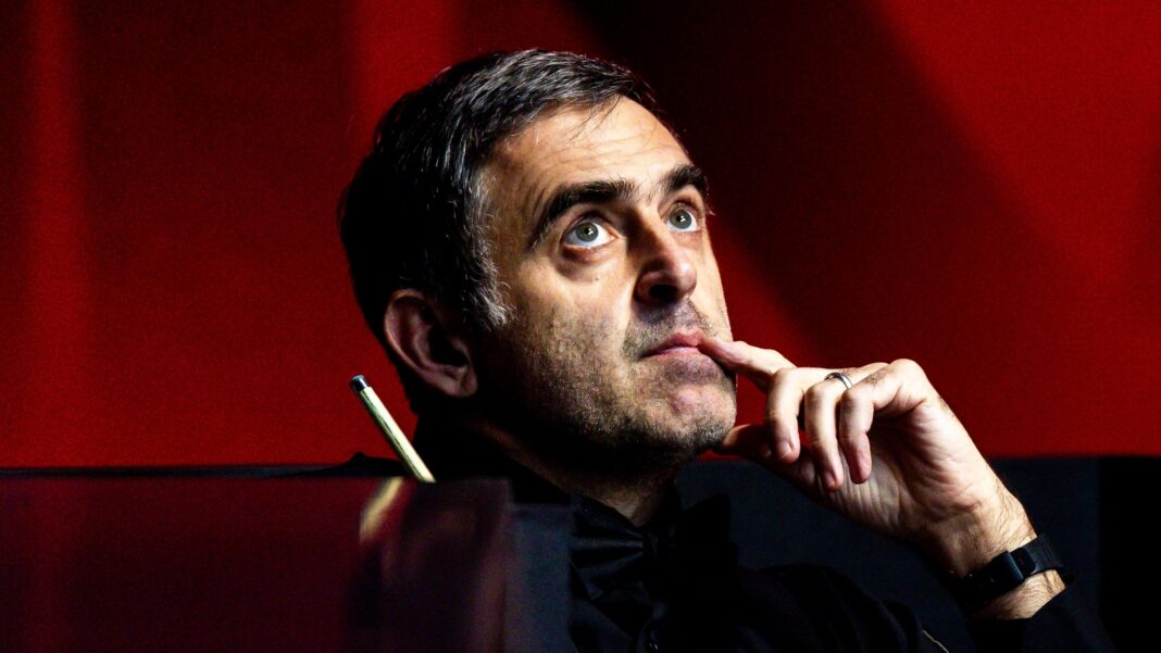 Why O’Sullivan faces battle to stay in world’s top 16 Ronnie O'Sullivan, looking upwards with his index finger touching the side of his mouth