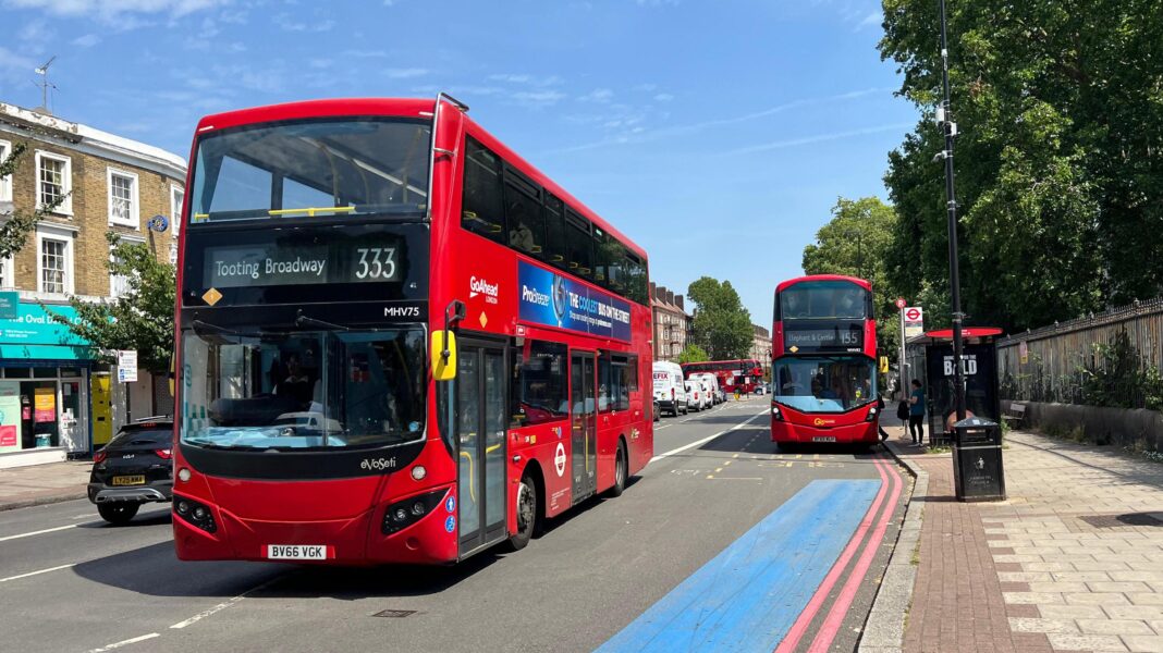Two red double-decker buses with 333 and 155 on front to Tooting Broadway and Elephant & Castle