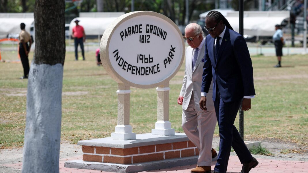 King visits Guyanan slave rebellion site on Caribbean tour King Charles and Steven Jacobs walk past the sign for Independence Park