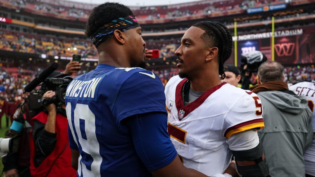 Jameis Winston and Jayden Daniels embrace after a 27-27 tie between the Washington Commanders and the New York Giants
