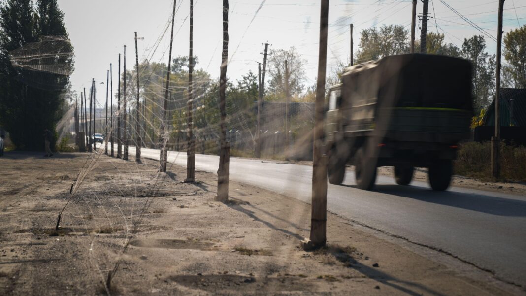 Cars driving under nets