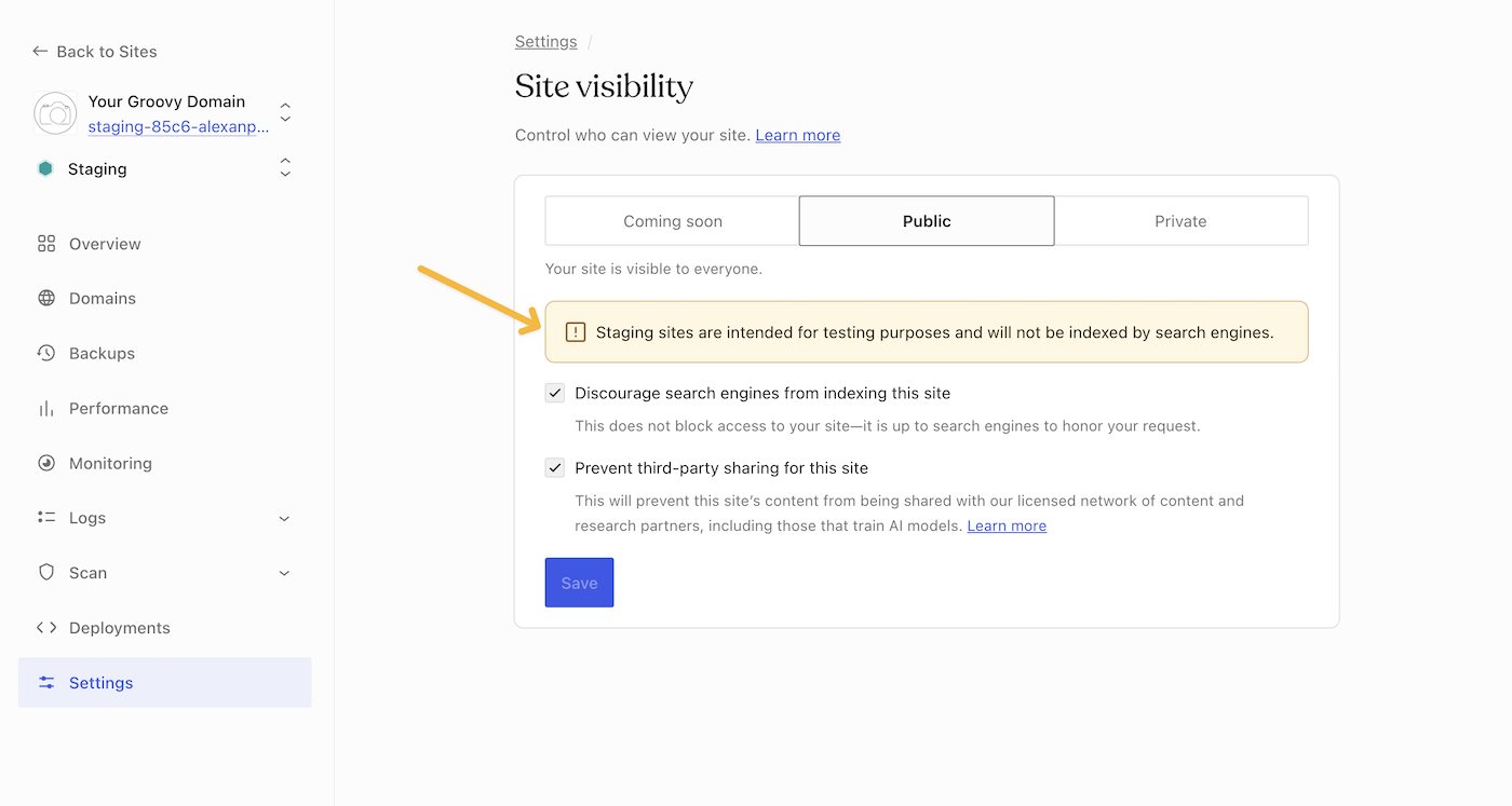 An arrow pointing to a staging site visibility notice on wordpress.com