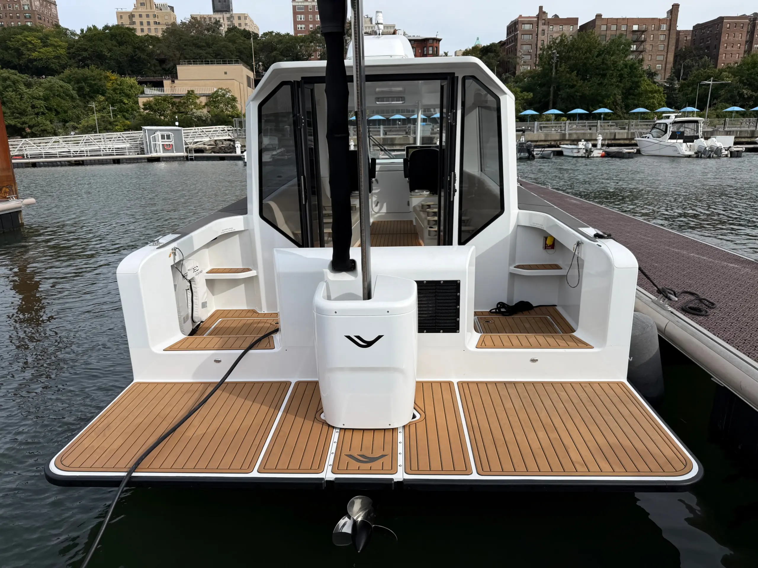A hydrofoil ferry docked with its rear foil raised.